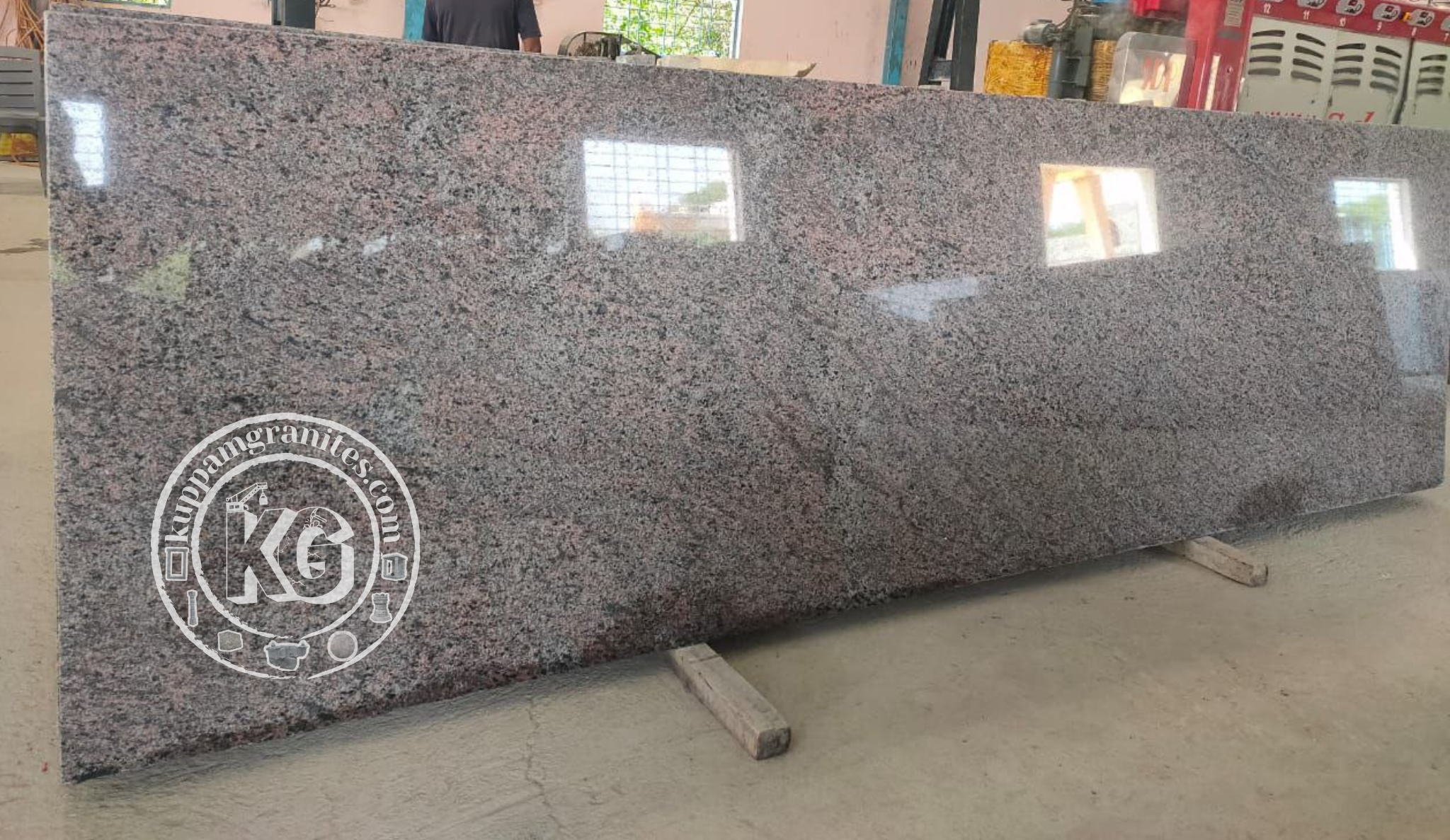 Polished Red Granite Slab with Subtle Black and Gray Speckles